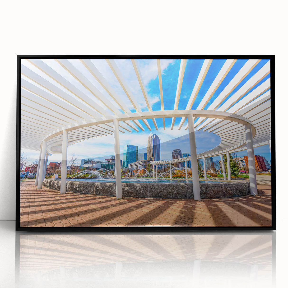 Large abstract wall art depicting Charlotte skyline in muted black and gray tones on a framed acrylic.