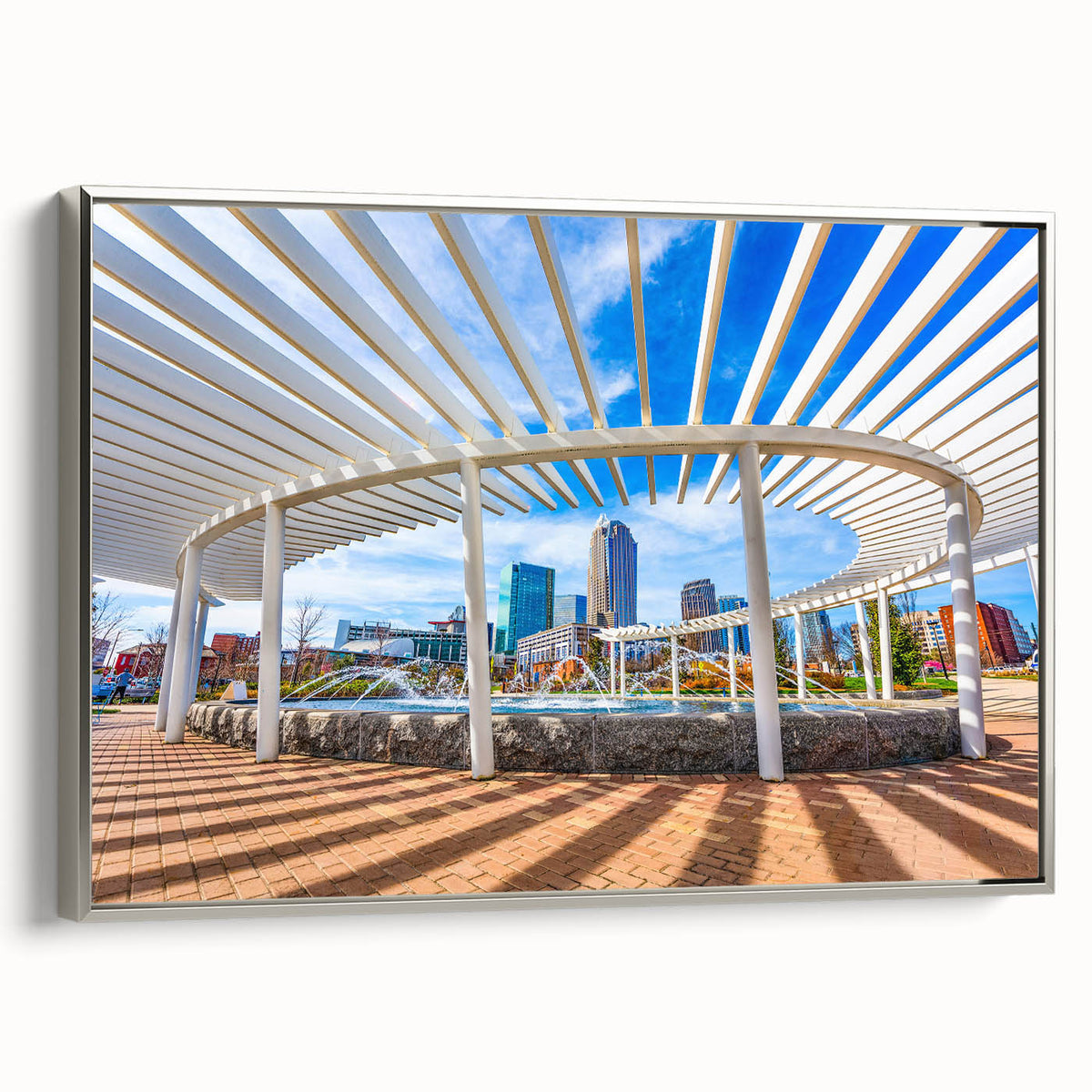 Framed canvas depicting a vintage-style Charlotte, North Carolina skyline in muted black and colorful accents.