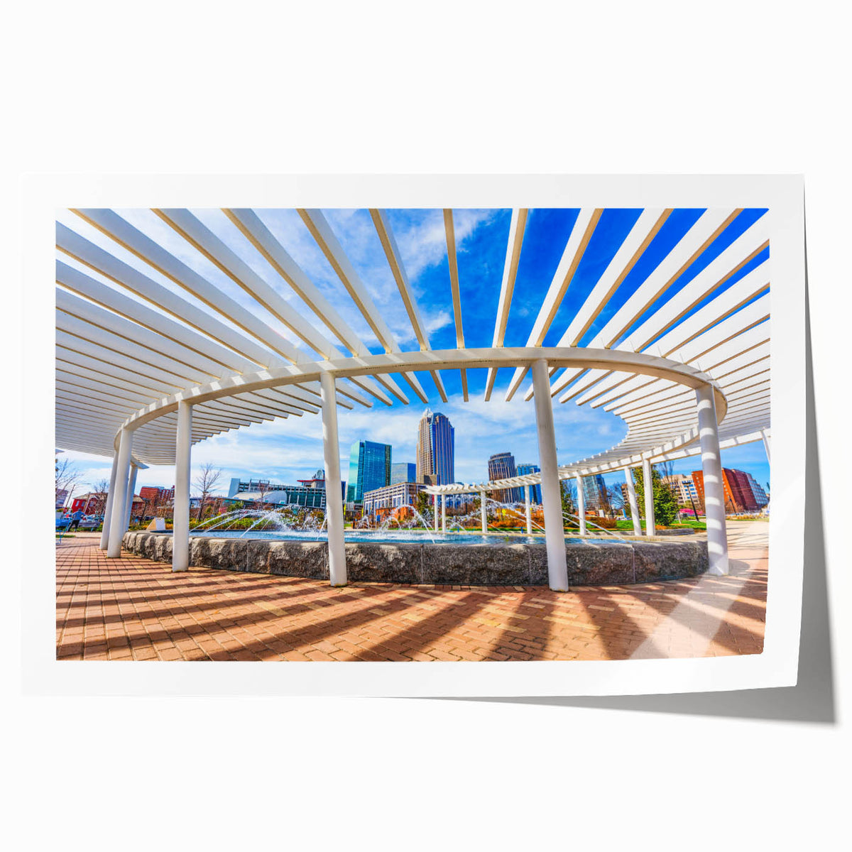 Rolled print of Charlotte, North Carolina skyline in muted gray and blue tones, ideal for dining room wall art.