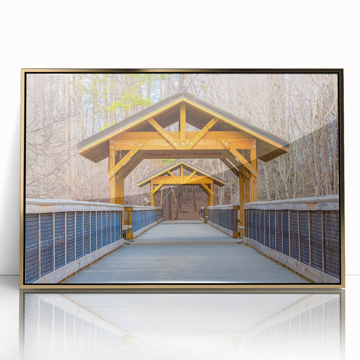 Raleigh skyline in muted gold and blue tones on a framed acrylic print, suitable for modern nursery decor.