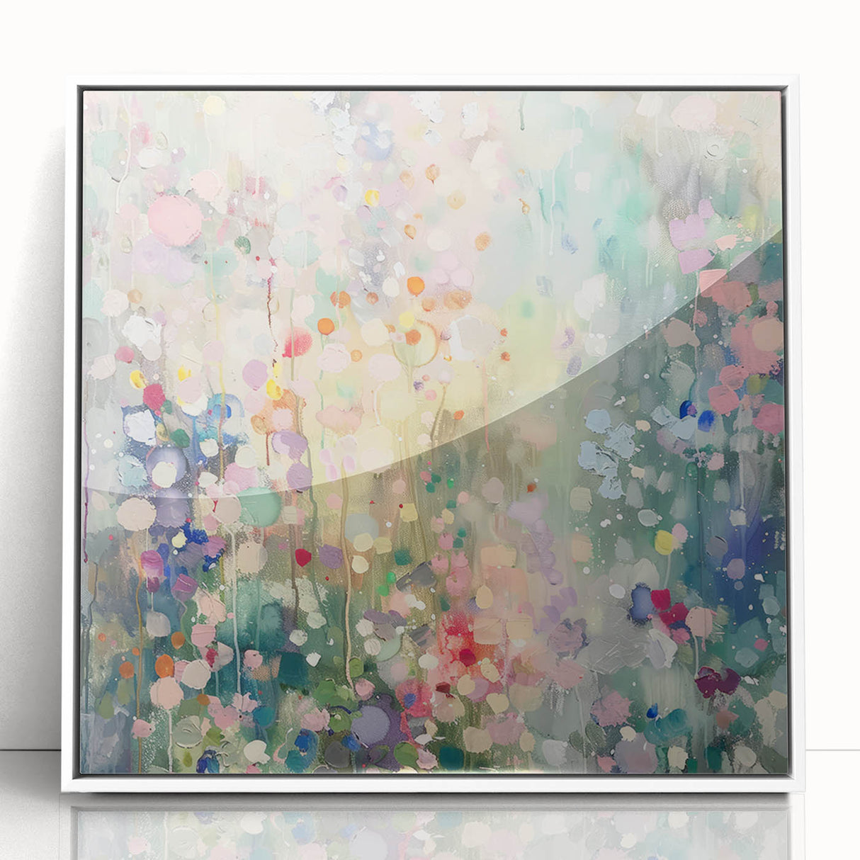 Framed acrylic artwork showcasing a modern abstract design with colorful splatters on a white background, perfect for contemporary home decor.