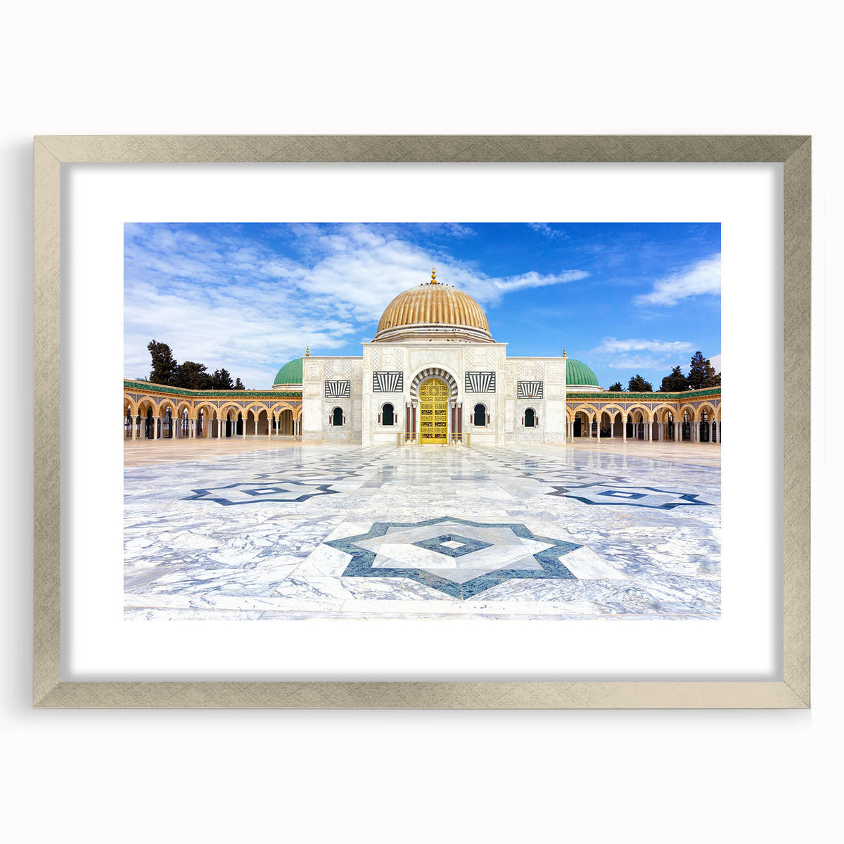 Textured abstract art print depicting a Tunisian landscape in earth tones on a silver-framed canvas.