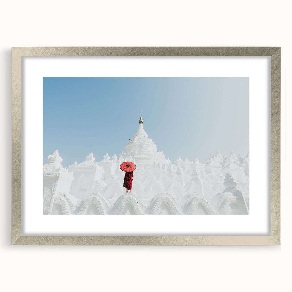 Textured art of a Myanmar landscape in muted earth tones on a framed silver mat, suitable for bedroom decor.