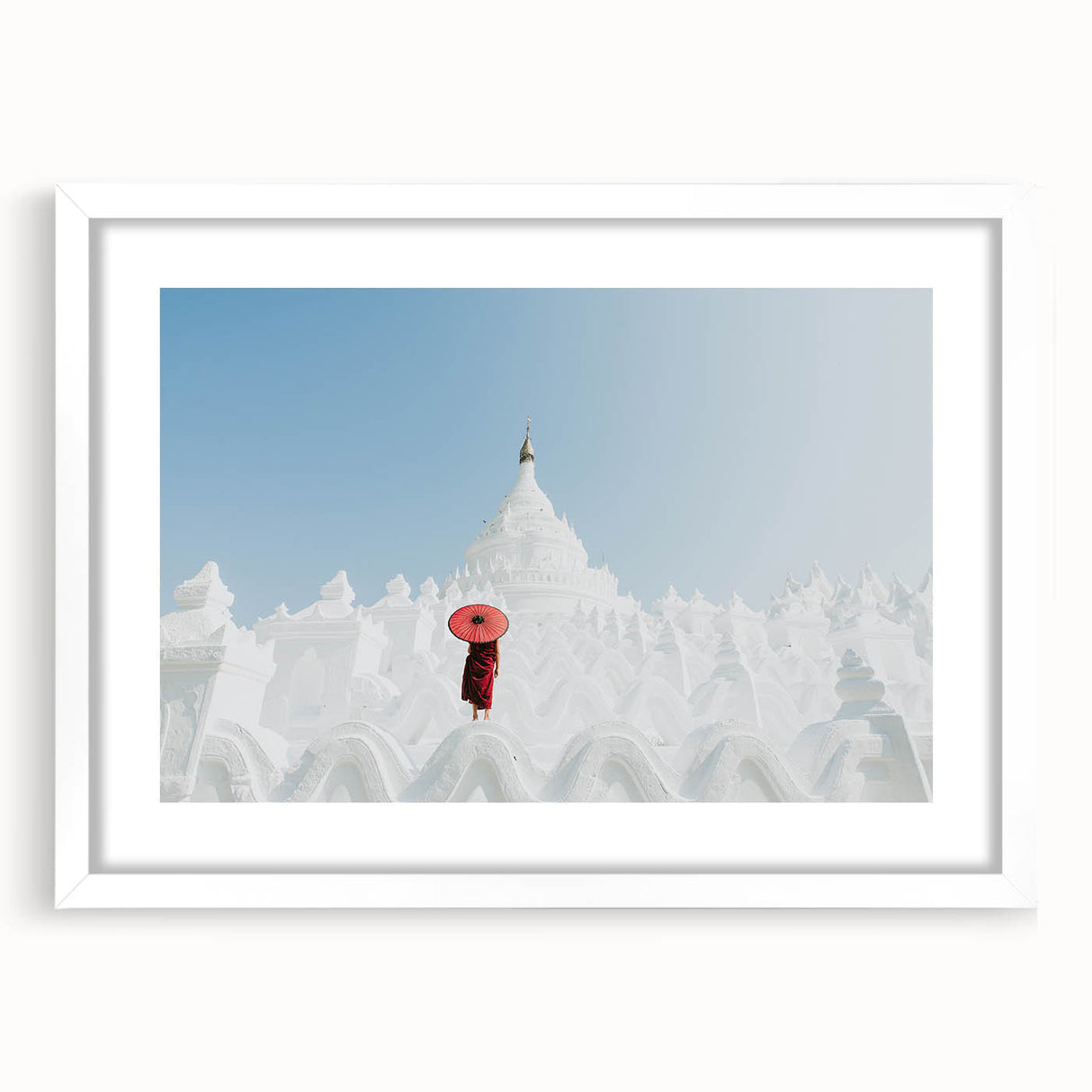 Abstract art print of a Myanmar landscape in muted earth tones on a framed white mat, ideal for dining room decor.