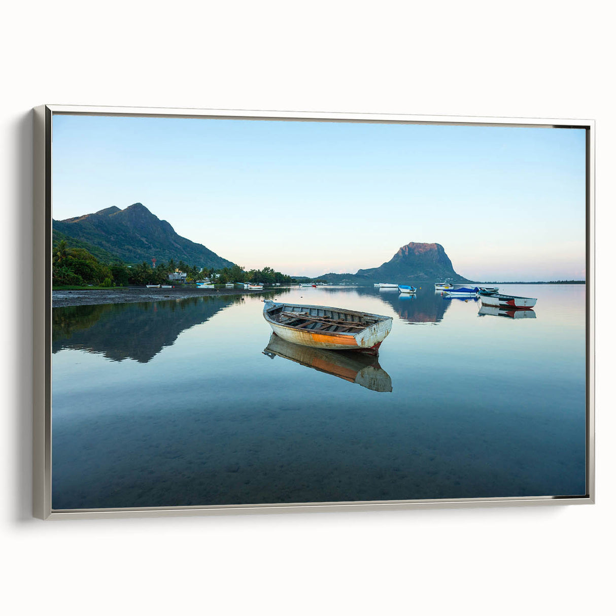 Framed canvas of a vintage-style Caribbean landscape in muted blues and greens, ideal for bedroom wall art.