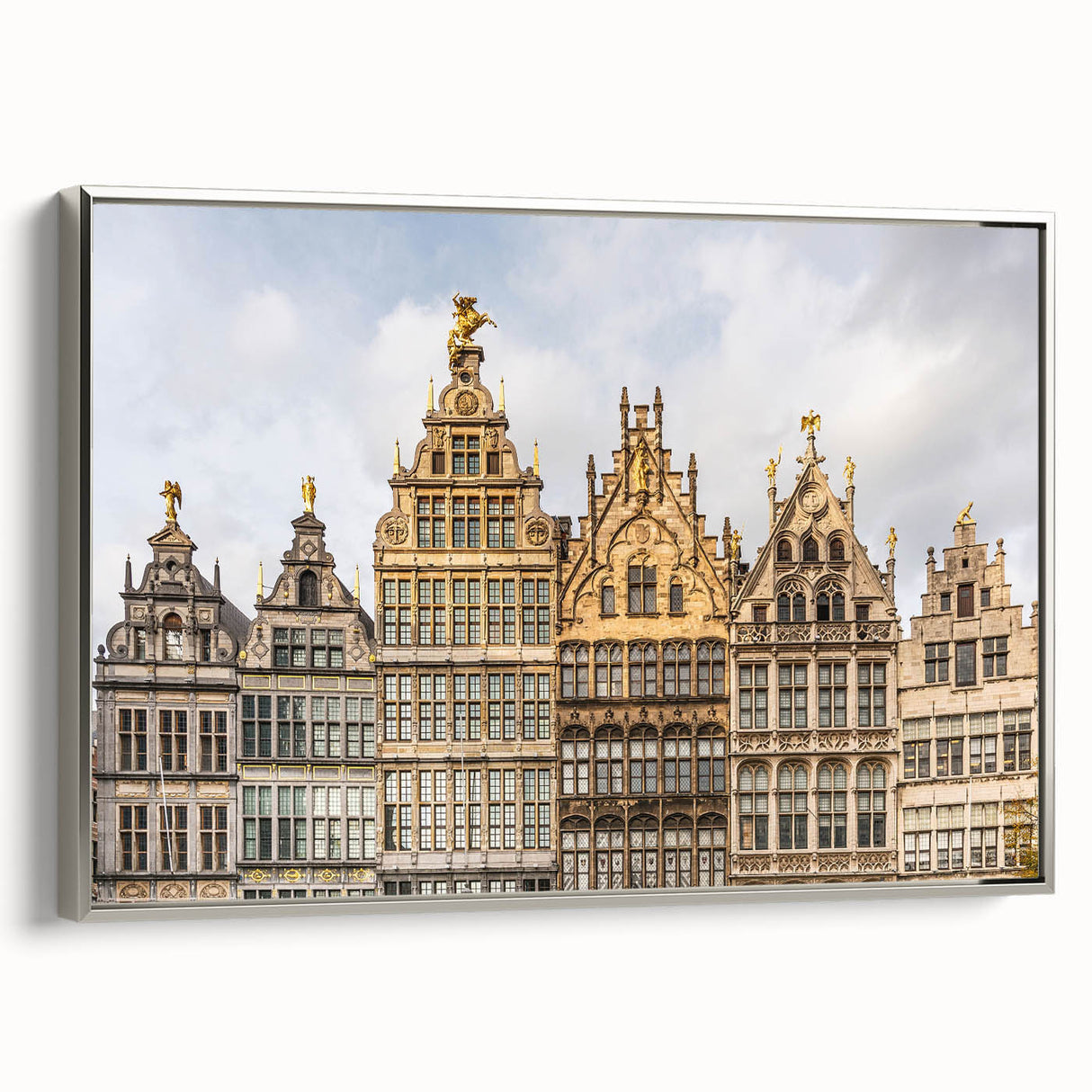 Framed canvas featuring a vintage-style landscape painting of a European scenery in muted earth tones.