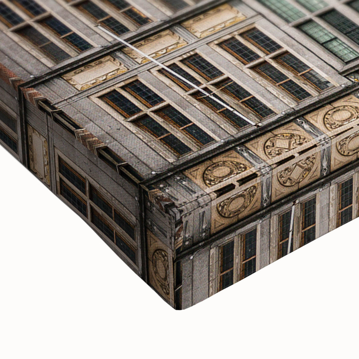 Large art featuring a black and white landscape painting of a European scenery on stretched canvas.