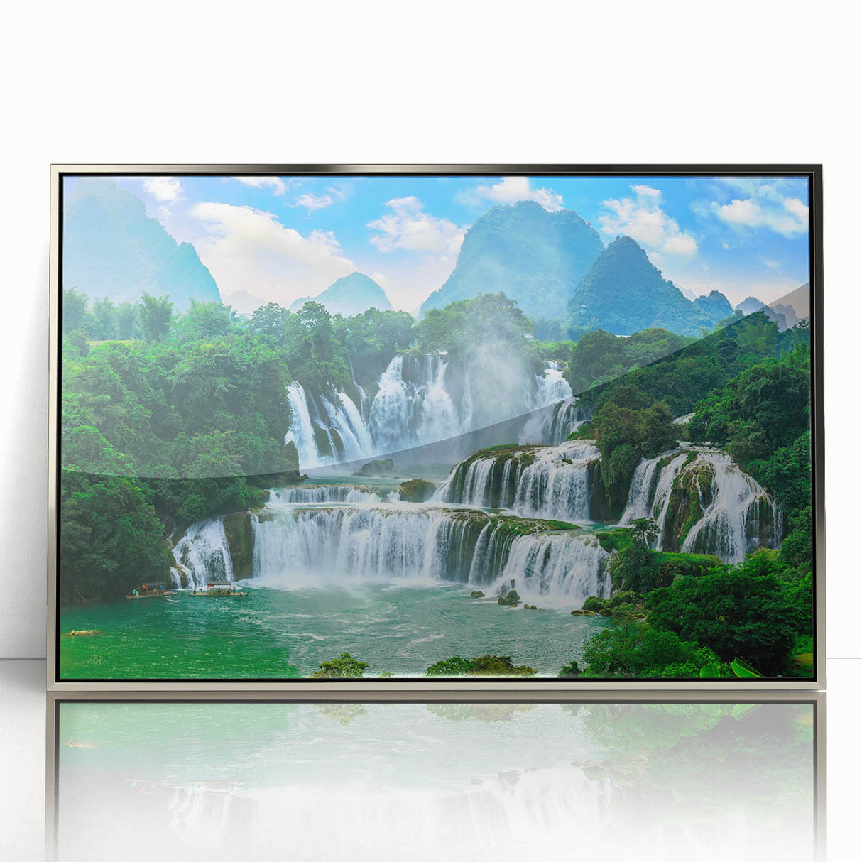 Large acrylic print of a Croatian landscape in muted green and blue tones, framed in silver.