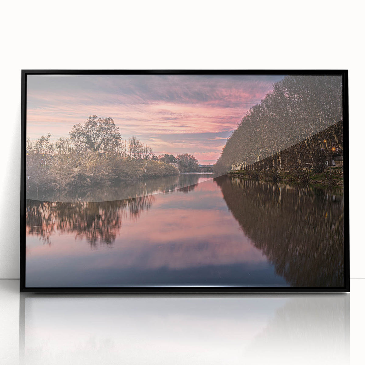 Large abstract wall art depicting a stylized scene of southern France, in muted earth tones on a black framed acrylic.