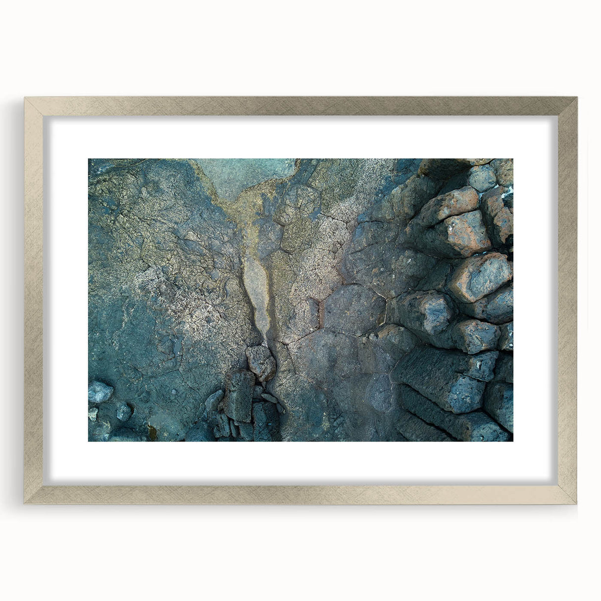 Extra large abstract art print of a textured European scenery in muted earth tones, framed in silver.