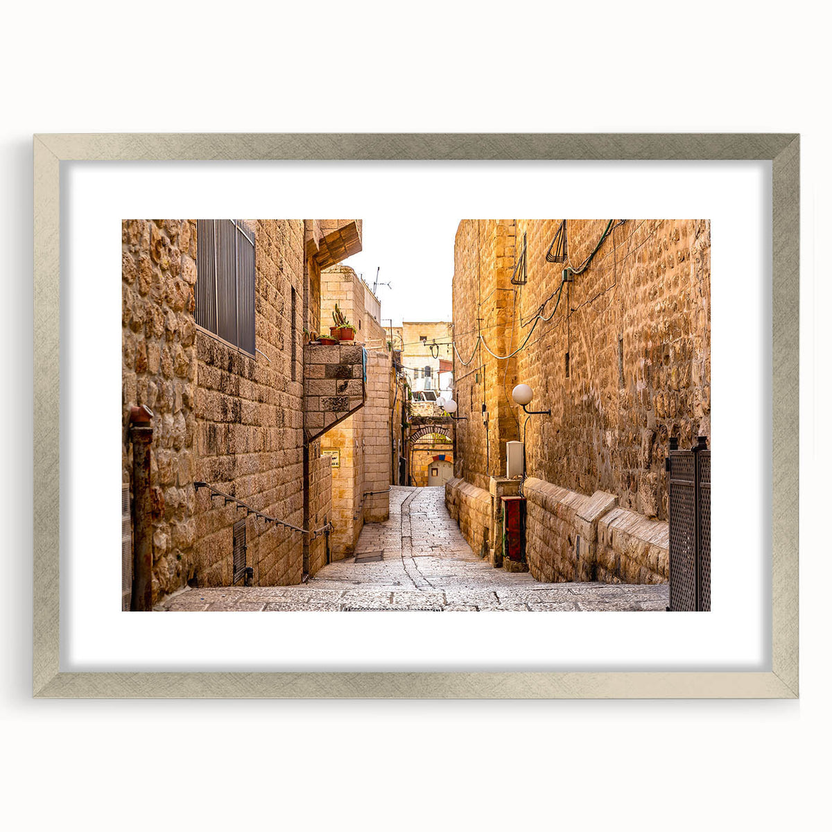 Textured art depicting an abstract Jerusalem cityscape in muted earth tones on a framed silver mat.