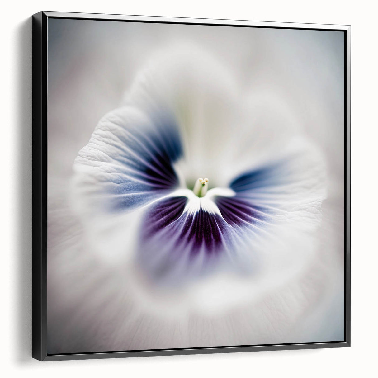 Framed abstract floral wall art in vibrant colors, showcasing a black and white design, displayed from the side to highlight its depth and texture. Perfect for modern home decor.