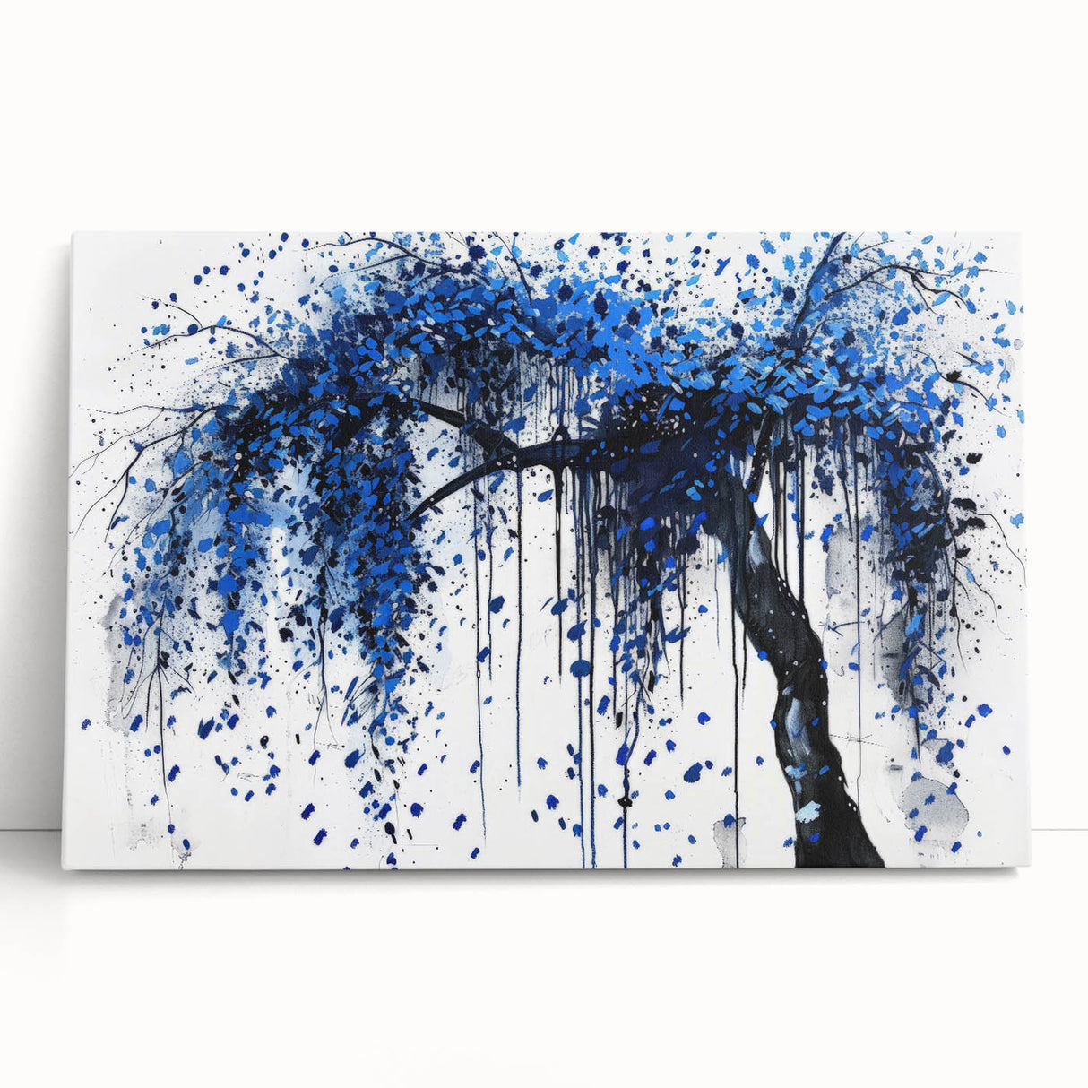 Abstract wall art canvas featuring colorful splatters in vibrant hues of blue, orange, and yellow, designed to add a modern touch to any space. The artwork leans against a neutral backdrop, emphasizing its dynamic visual impact.