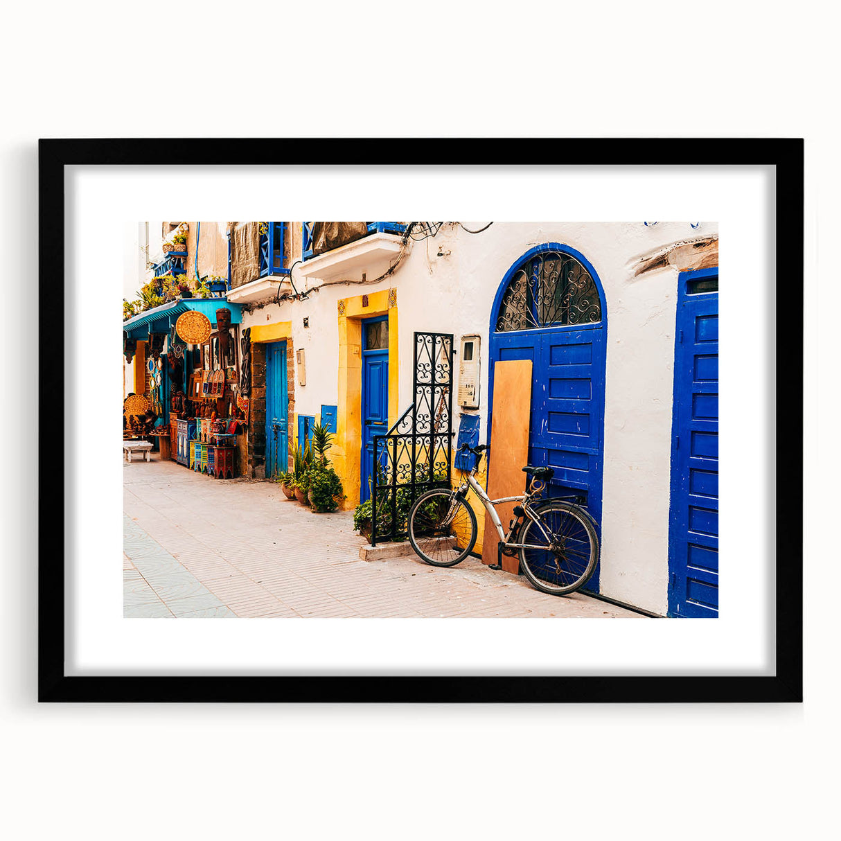 Extra large abstract art print of a Moroccan landscape in colorful, textured tones on a framed black mat.