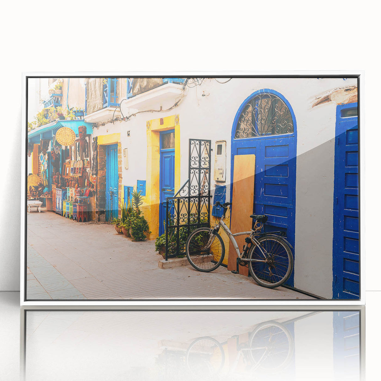 Large art print of a Moroccan landscape in mid-century modernist style, framed in white acrylic.