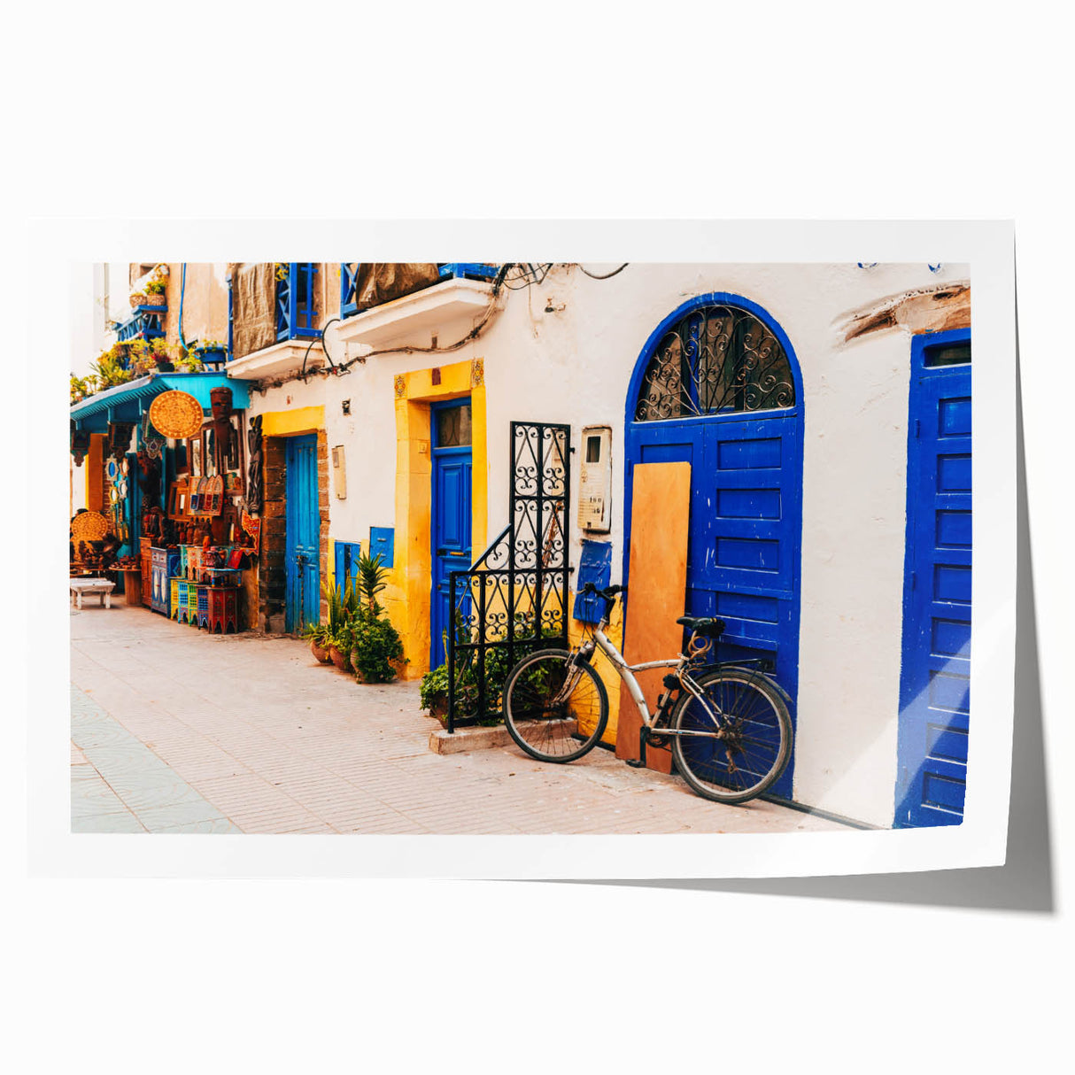 Extra large rolled print of a Moroccan landscape with vibrant floral elements on canvas, suitable for dining room decor.