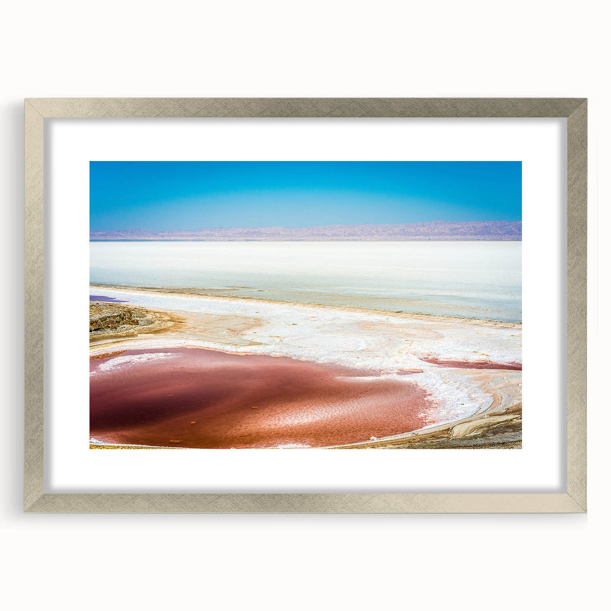 Textured abstract art print depicting a Tunisian landscape in earthy tones on a framed silver mat, ideal for bedroom decor.