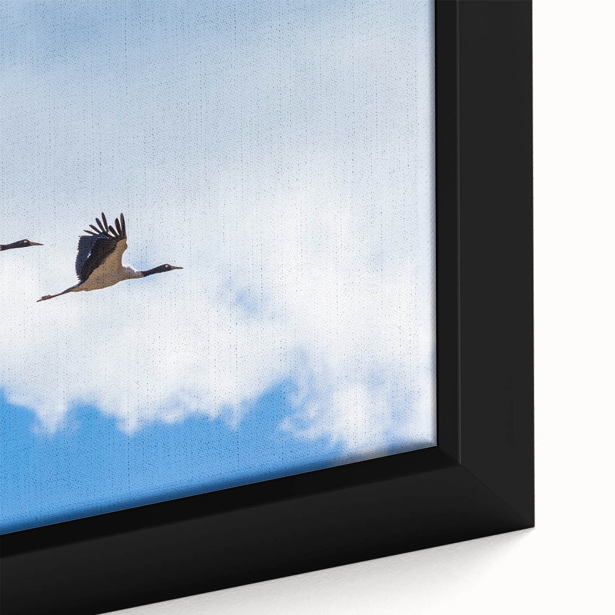 Extra large framed canvas of a black textured art piece depicting colorful Bhutanese scenery, ideal for living room decor.