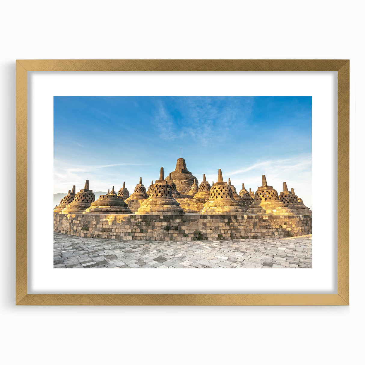 Extra large abstract art print featuring textured scenery of Indonesia, in gold frame, suited for living room decor.