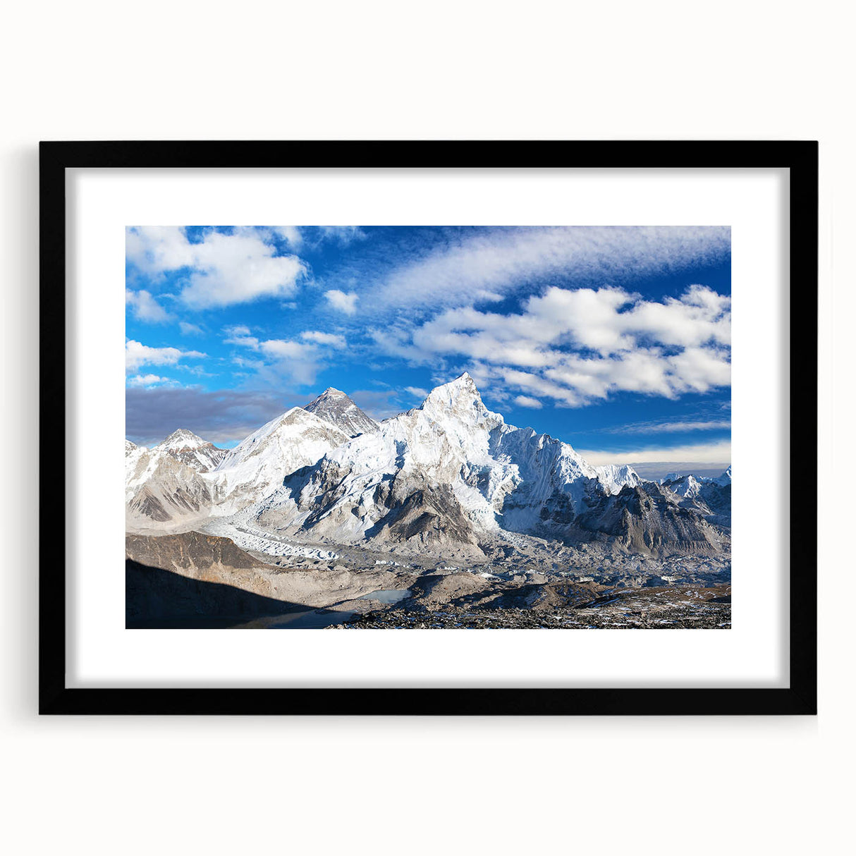 Abstract art print depicting a colorful, textured landscape of Nepal, framed in black, ideal for large living room walls.