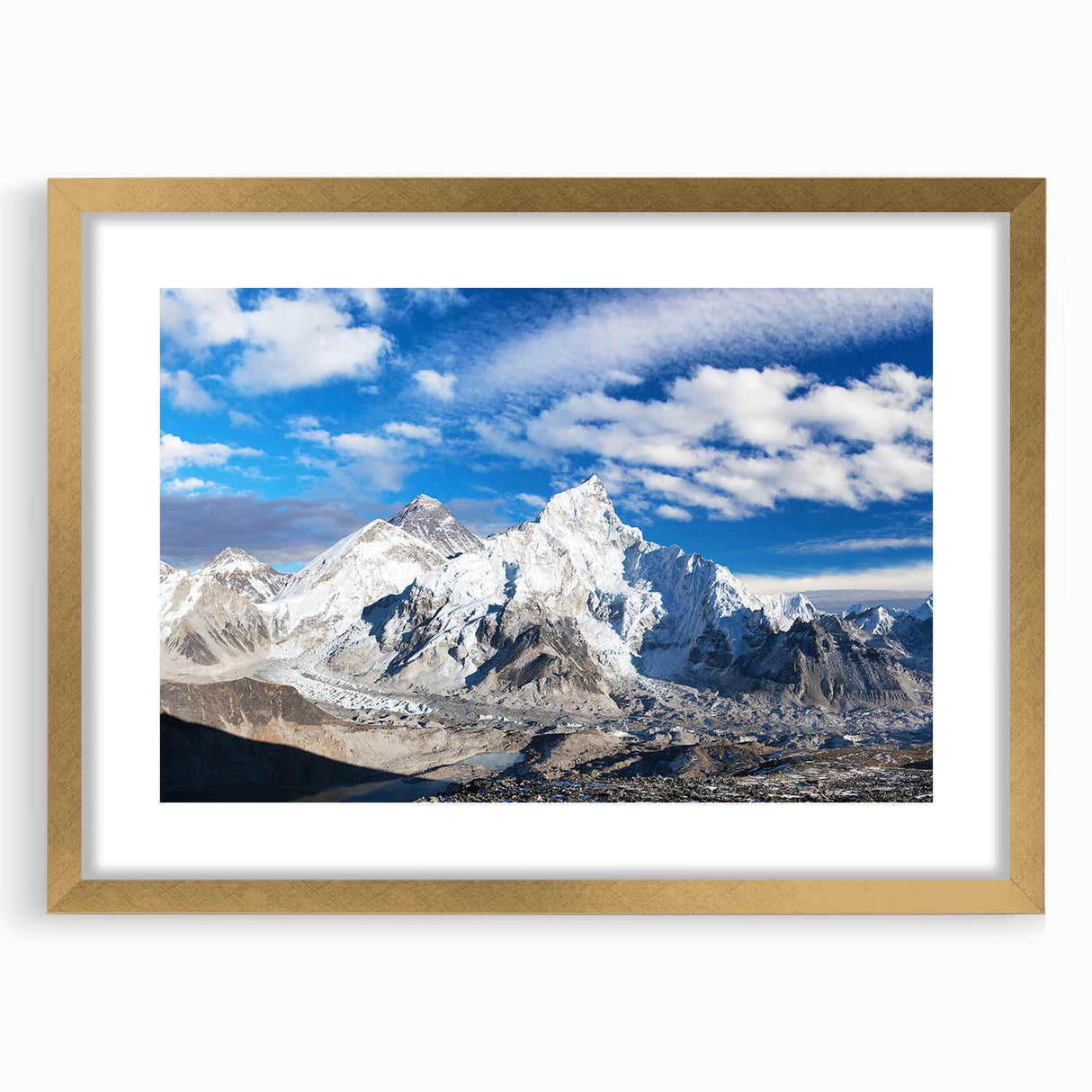 Extra large wall art featuring an abstract depiction of a Nepalese landscape in textured gold tones, framed with a mat.