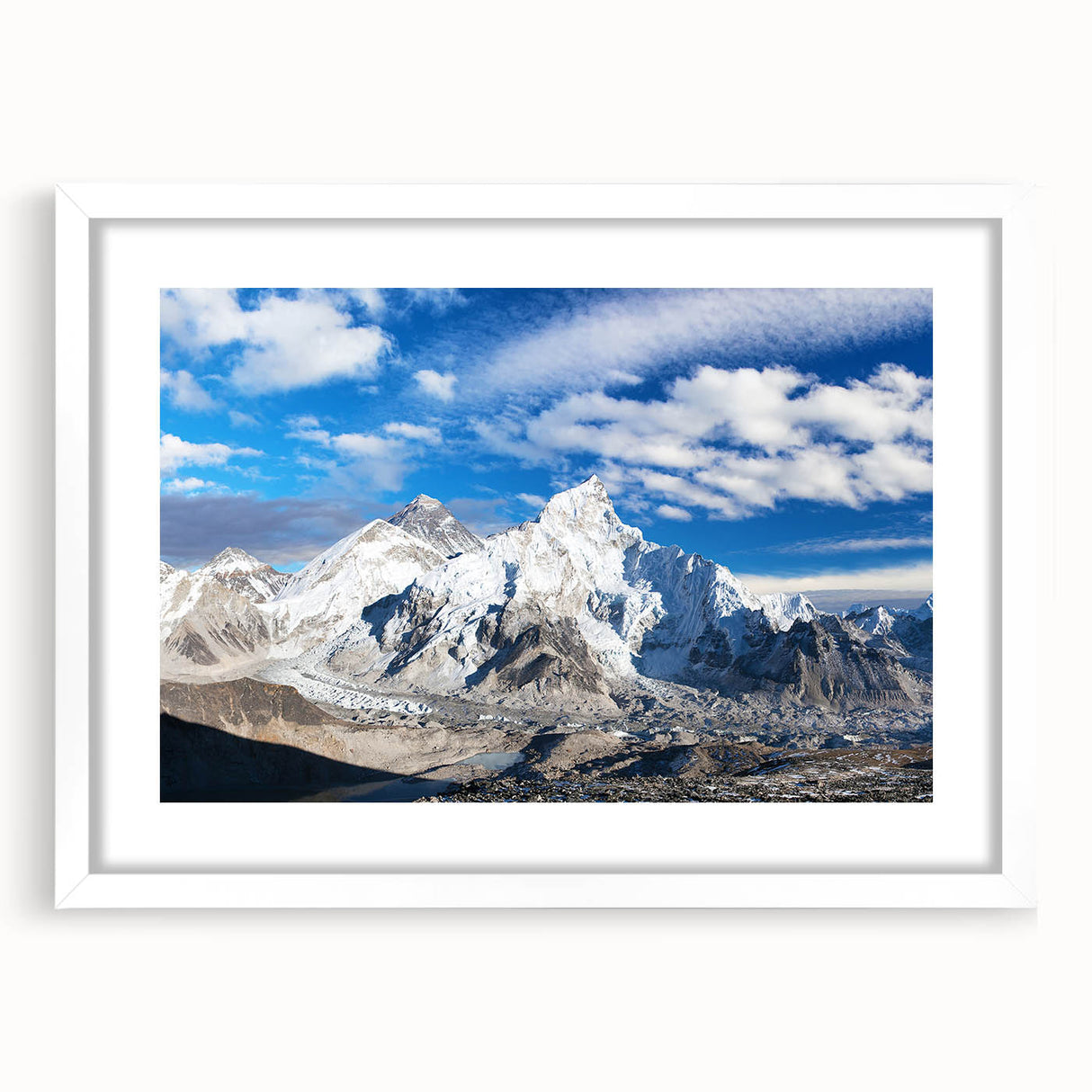 Abstract art print of a Nepalese landscape in muted earth tones, framed in white, ideal for dining room decor.