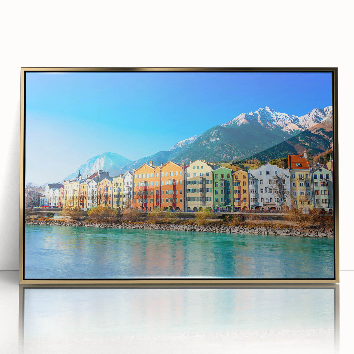 Art Deco poster of a European scenery in Austria, featuring muted gold and blue tones on a framed acrylic.