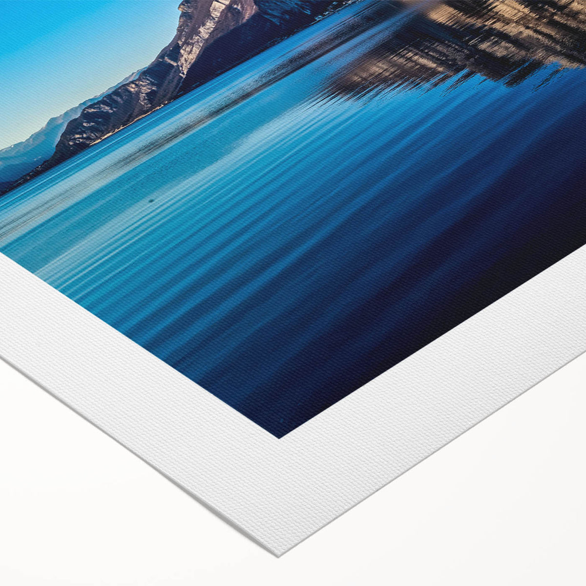 Art deco poster of Lake Como with soft blue and green hues on rolled canvas, suitable for dining room decor.