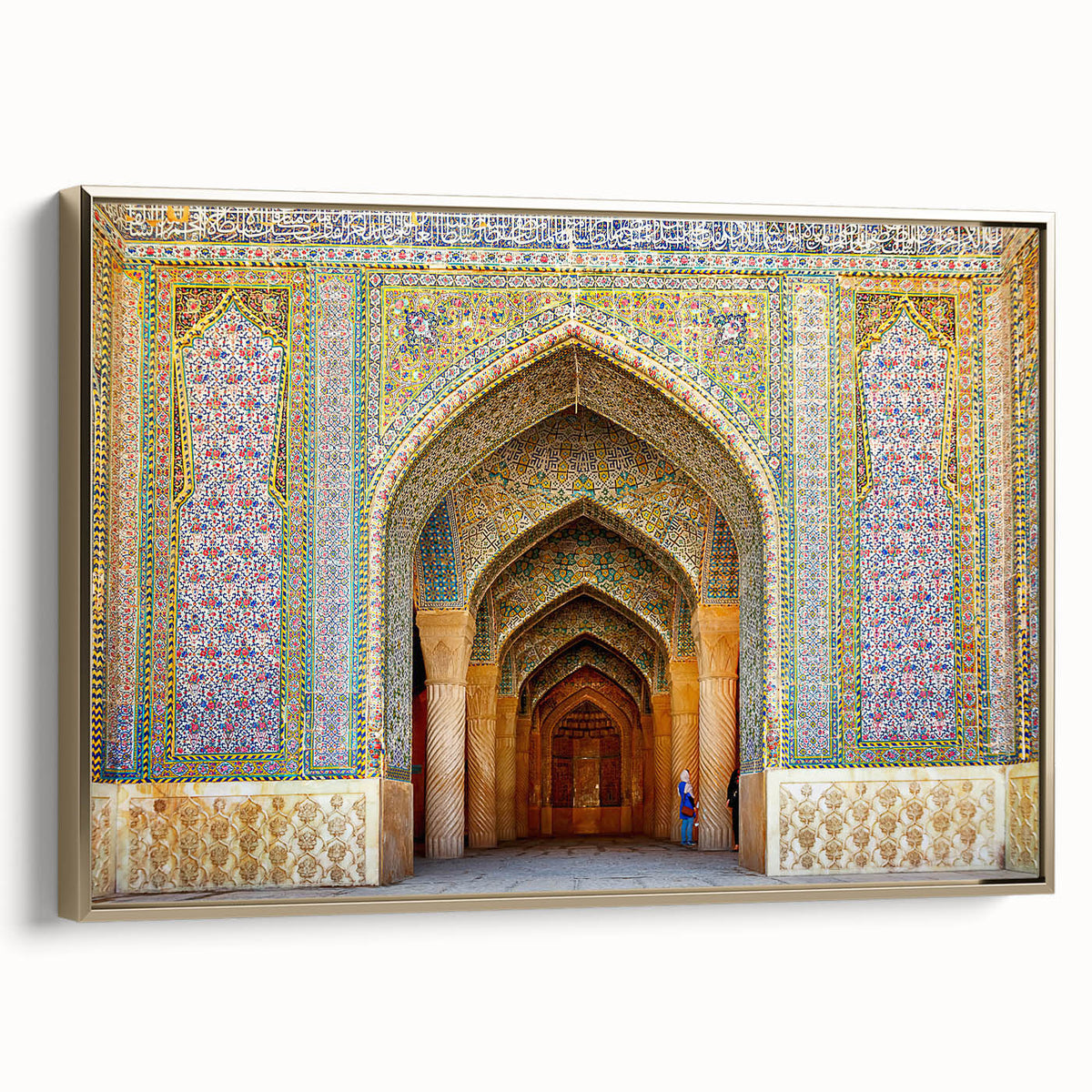 Framed canvas featuring a vintage-style landscape painting of a Middle Eastern scene in gold and black tones.