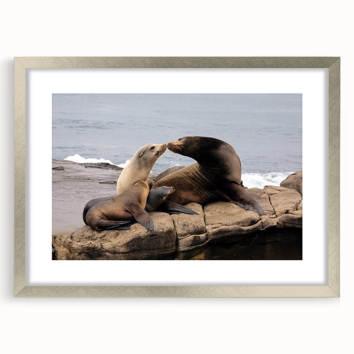 Textured abstract art print of San Diego scenery in muted earth tones, framed in silver, ideal for bedroom wall decor.