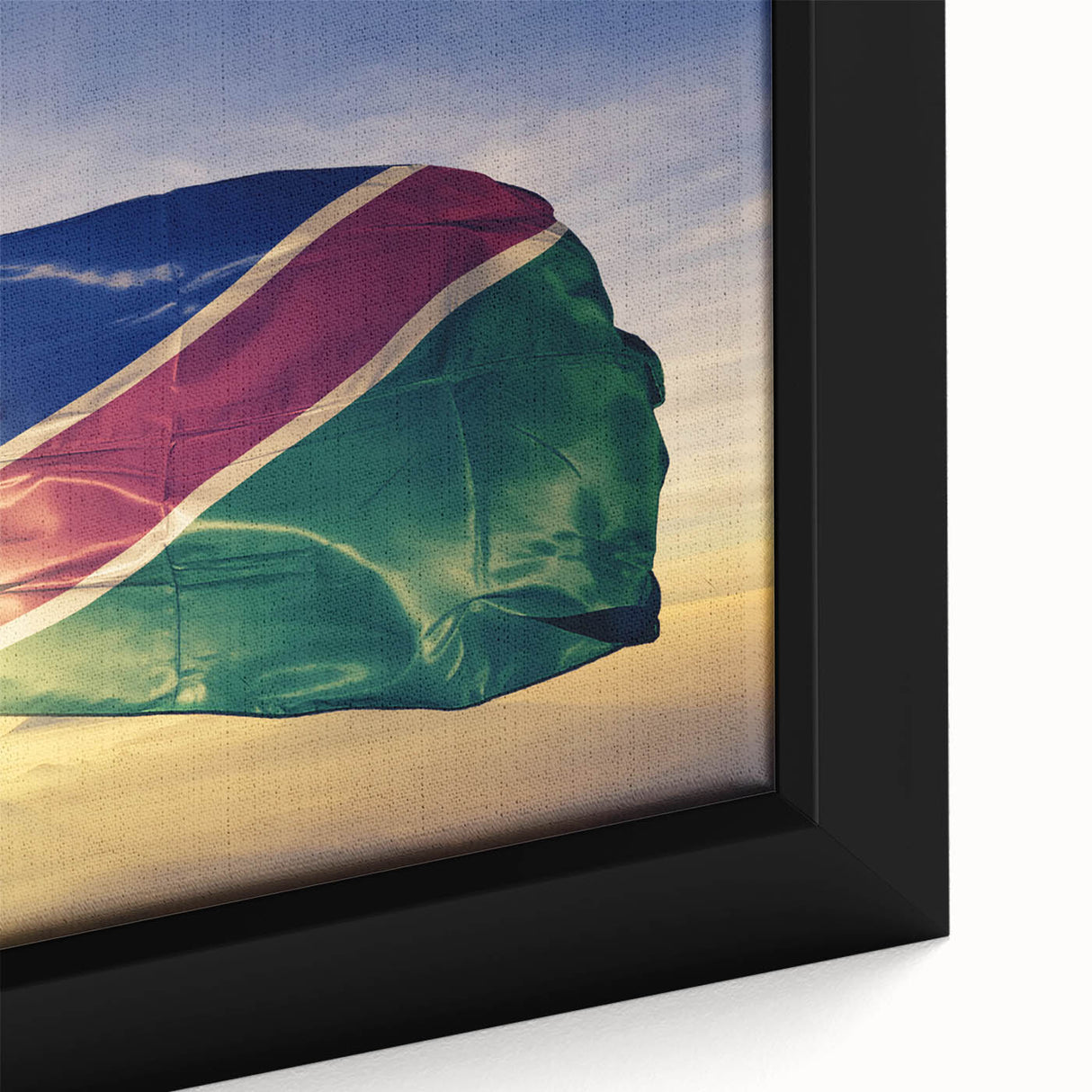 Close-up of extra large framed canvas featuring a textured, colorful African scenery on a black background.