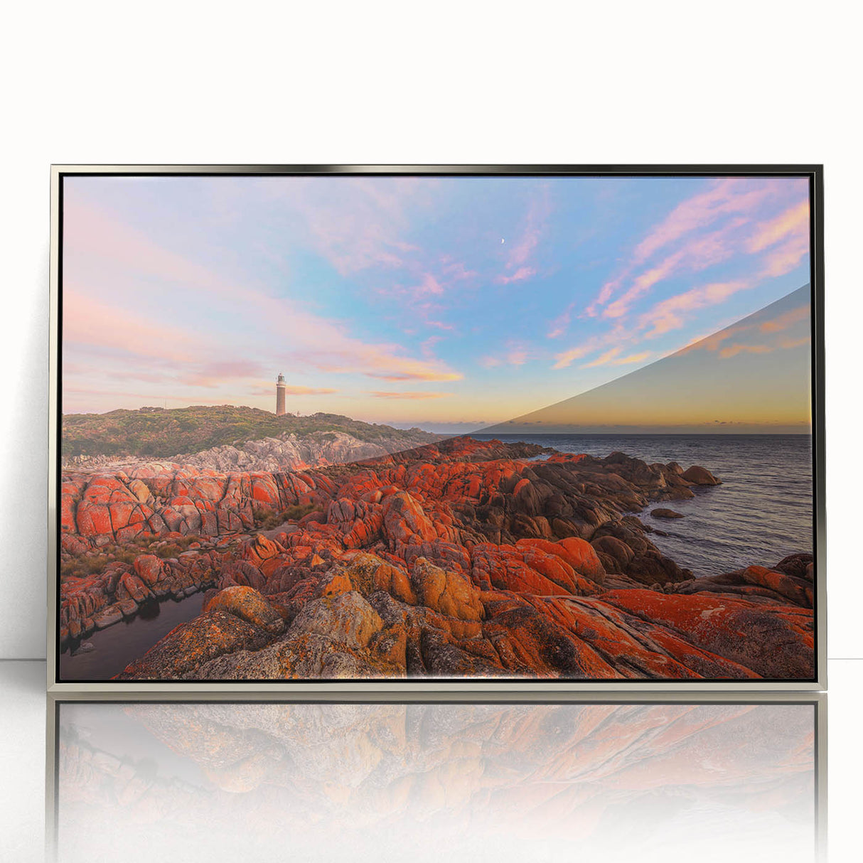 Large art print of a Tasmanian landscape in muted green and blue tones, framed in silver acrylic.