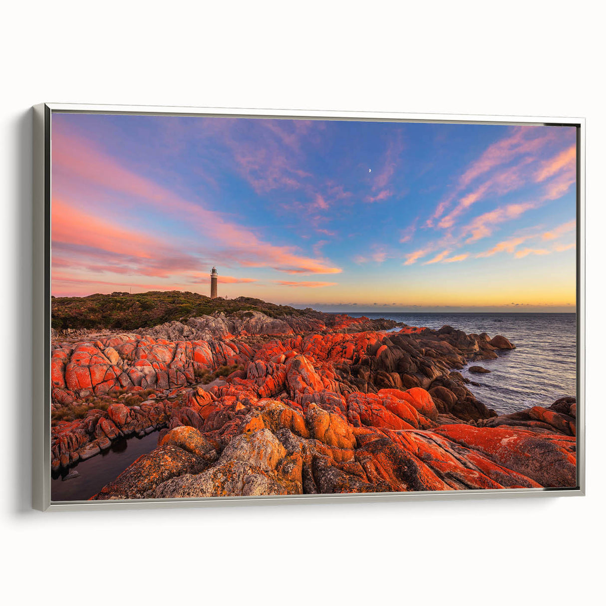 Framed canvas featuring a vintage-style landscape painting of Tasmania with muted earth tones and touches of vibrant green.