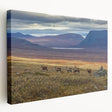 Side view of a stretched canvas featuring a serene Swedish landscape in muted green and blue tones.