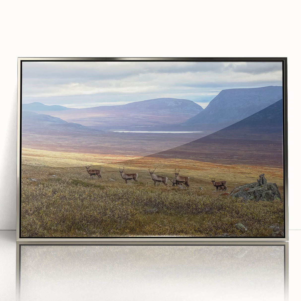 Mid-century modernist art of a European landscape in silver framed acrylic, with muted earth tones.