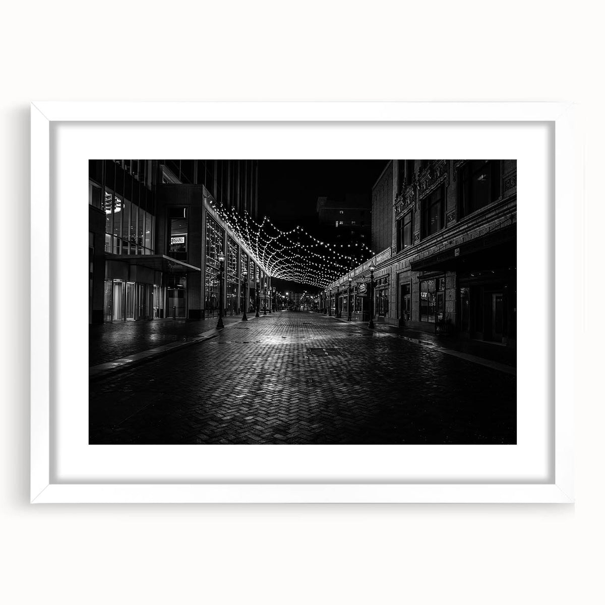 Abstract art print depicting the Detroit skyline in cool blue tones on a framed white mat, ideal for dining room decor.