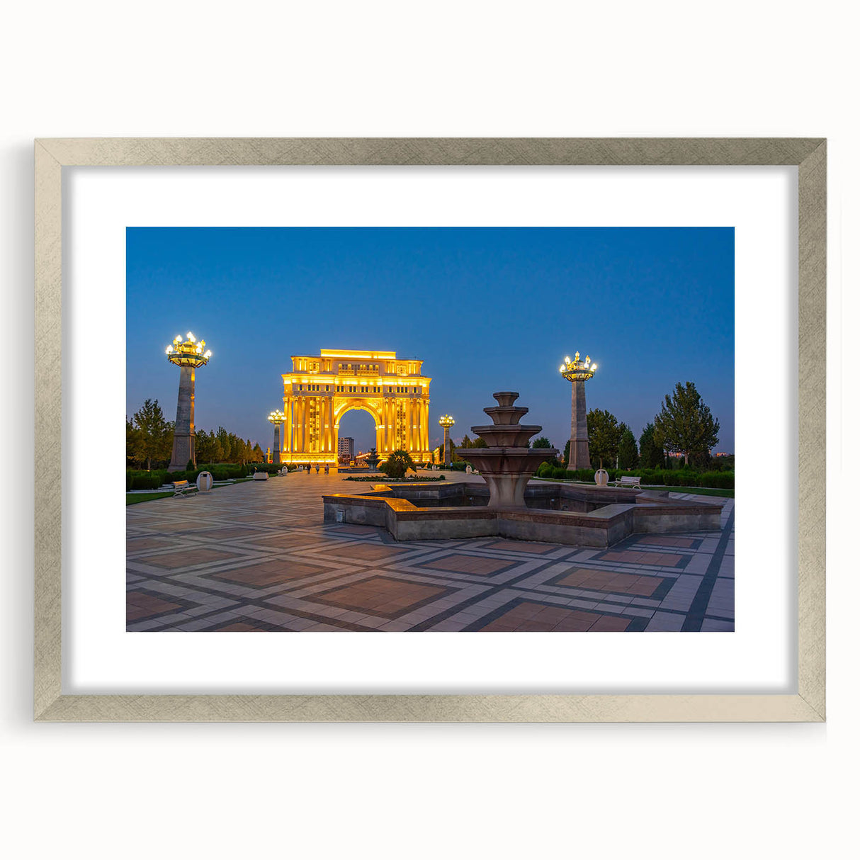 Textured art depicting abstract scenery in muted earth tones on a silver-framed mat, suitable for bedroom decor.