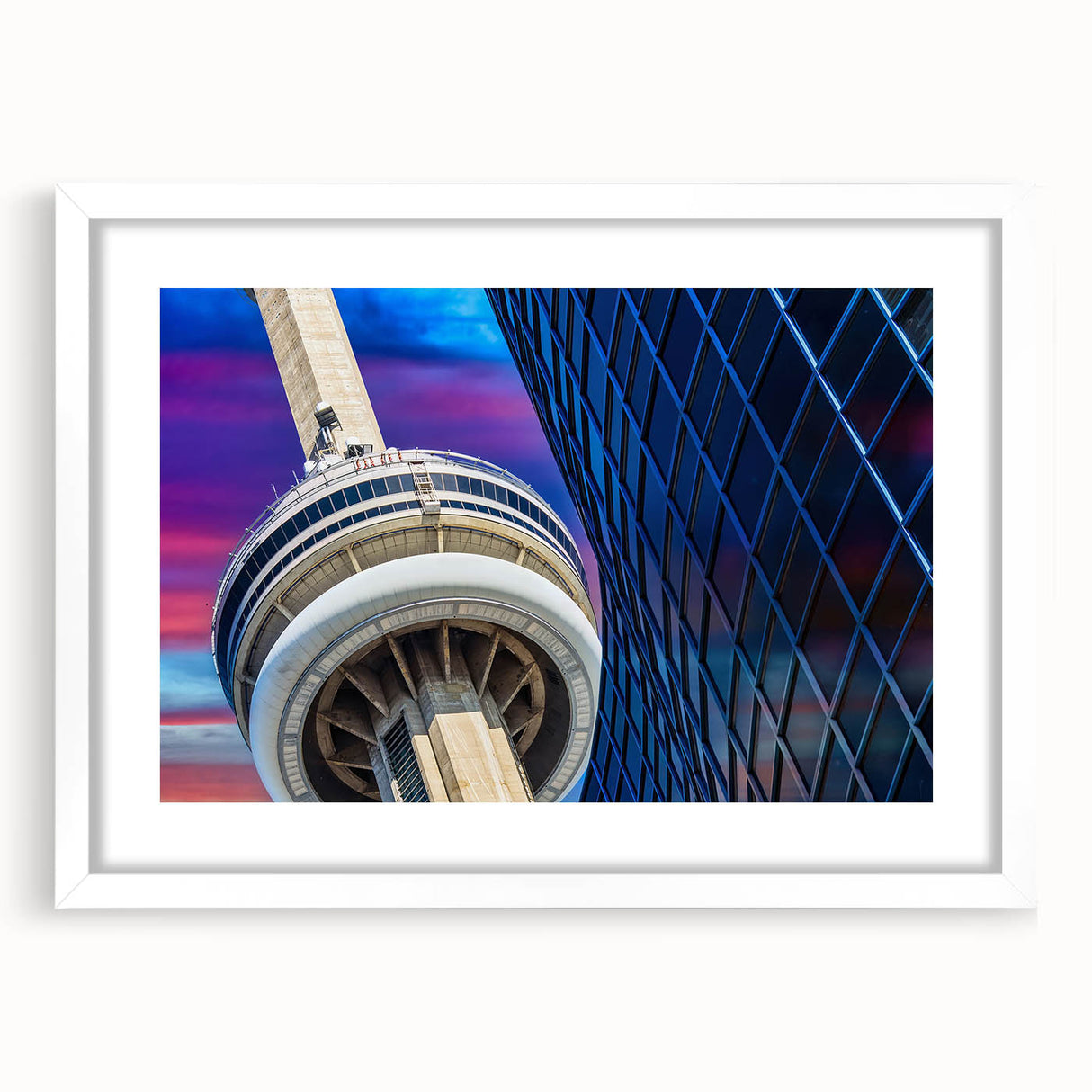 Abstract art print of Ontario scenery in muted blue and green tones, framed with a white mat.