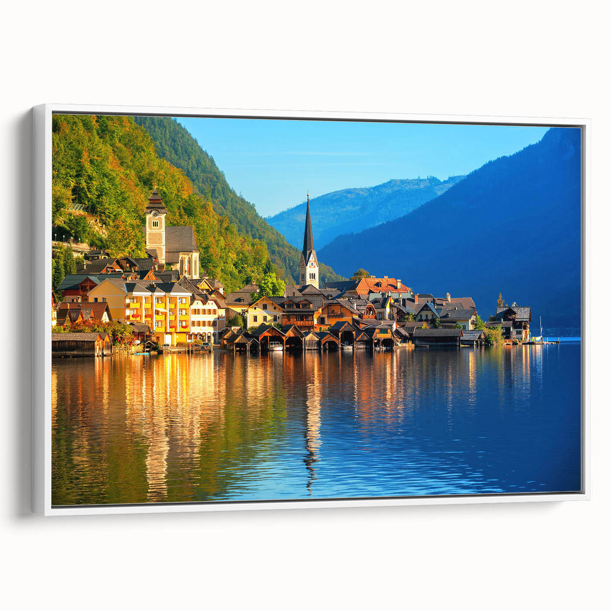 Landscape art painting of a scenic European village on a framed canvas, featuring vibrant colors on a black background.