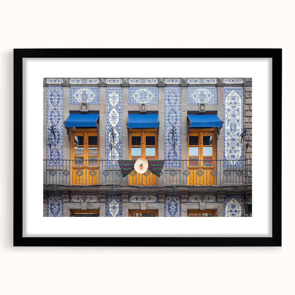 Extra large abstract art print of Mexico City, featuring vibrant, colorful textures on a black framed canvas.