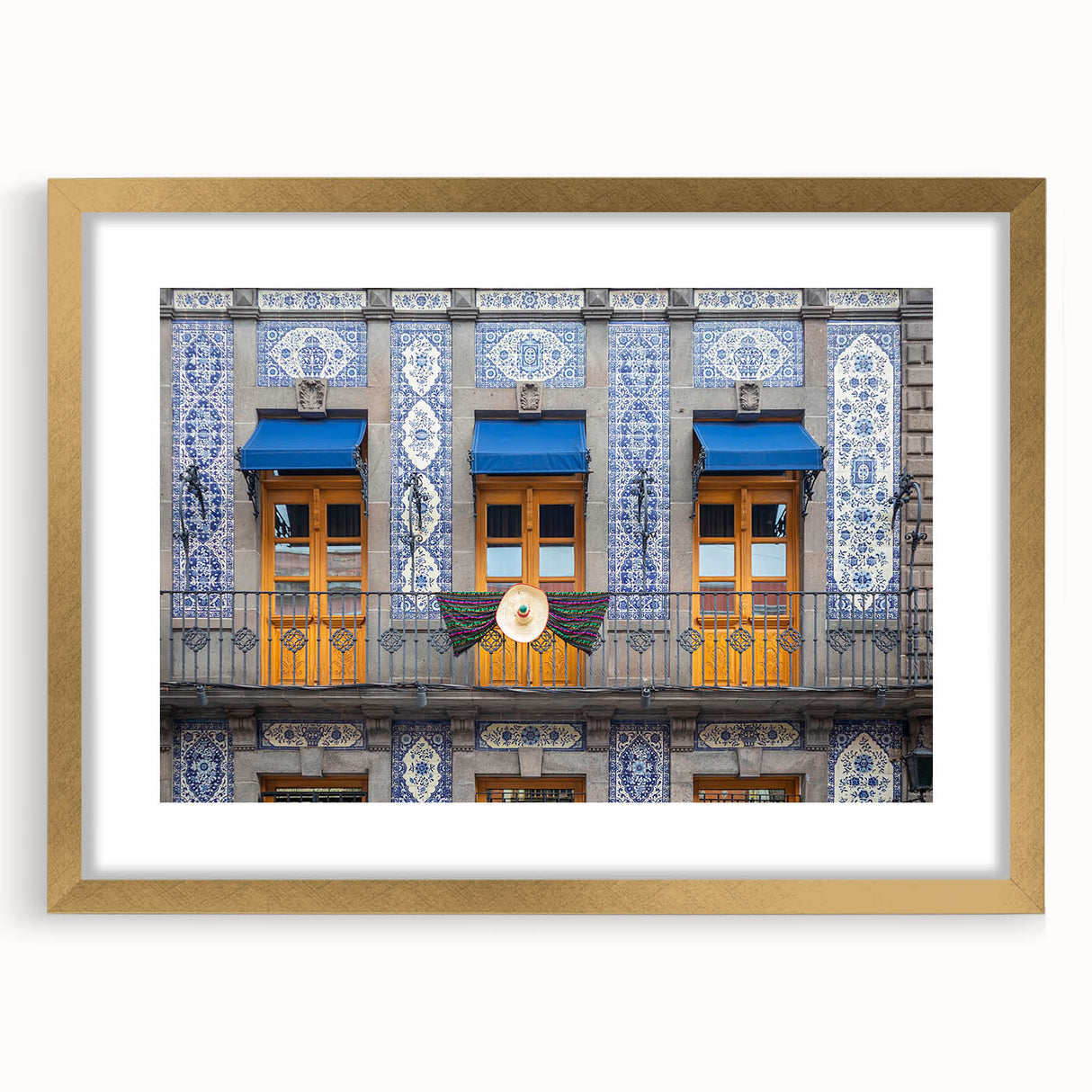 Extra large abstract art print of Mexico City, in gold frame with mat, featuring textured strokes in earth tones.