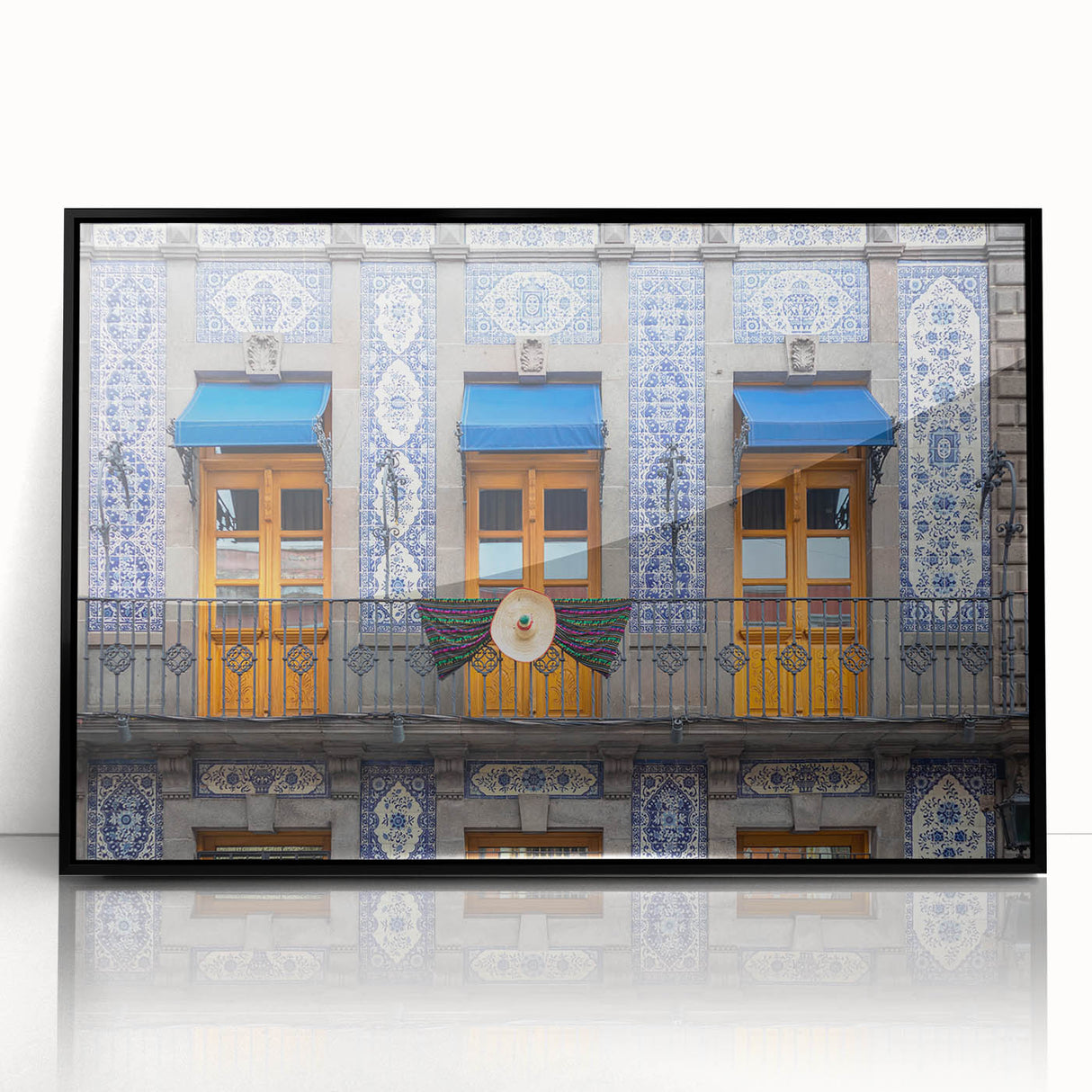 Large abstract wall art depicting a stylized Mexico City scene in cool gray and blue tones, framed in black acrylic.
