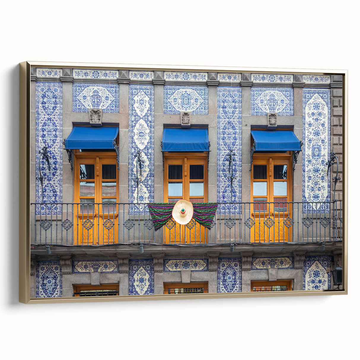 Framed canvas featuring a vintage-style landscape painting of Mexico City in muted gold and black tones.