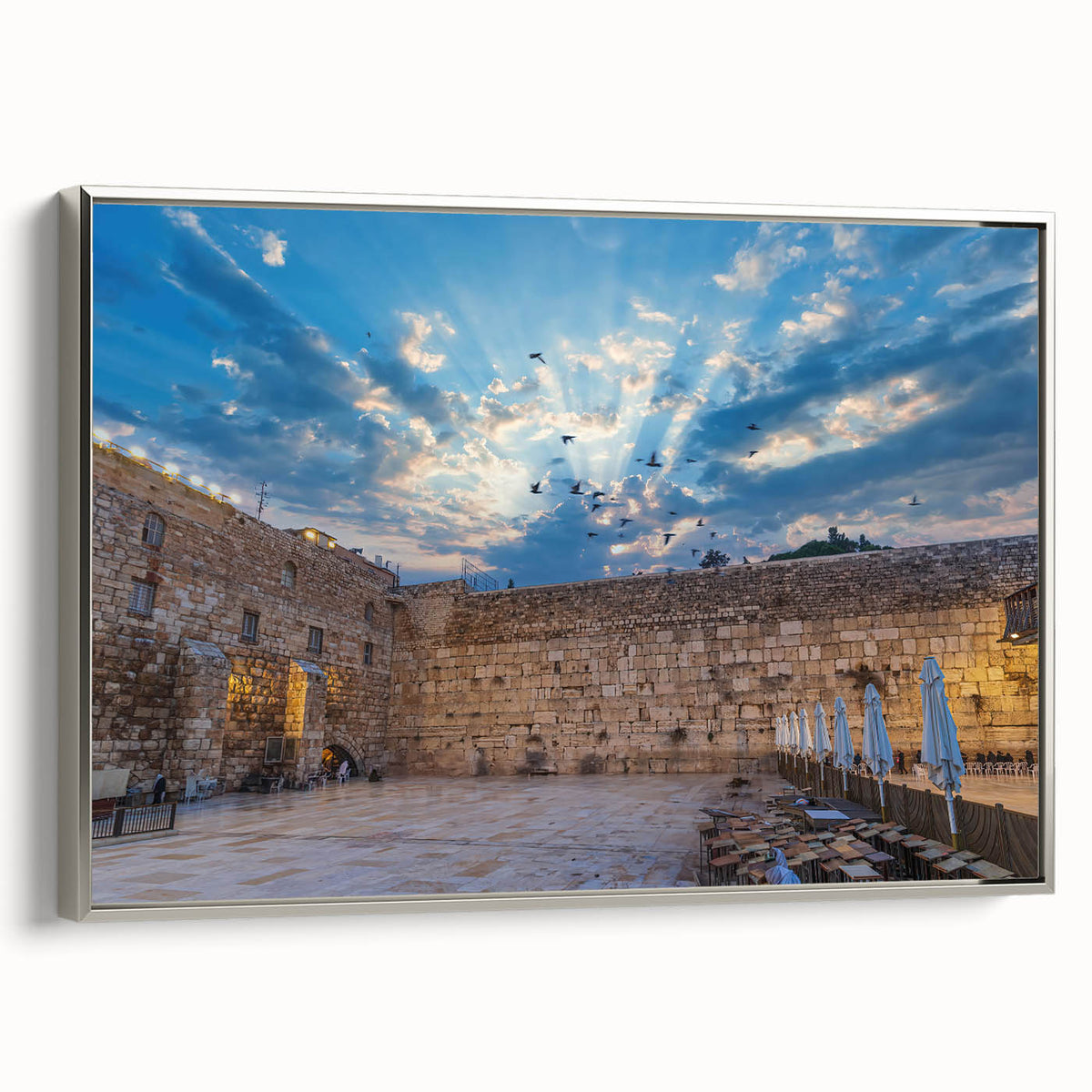 Framed canvas of Jerusalem landscape in vintage poster style, featuring colorful art on a black background.
