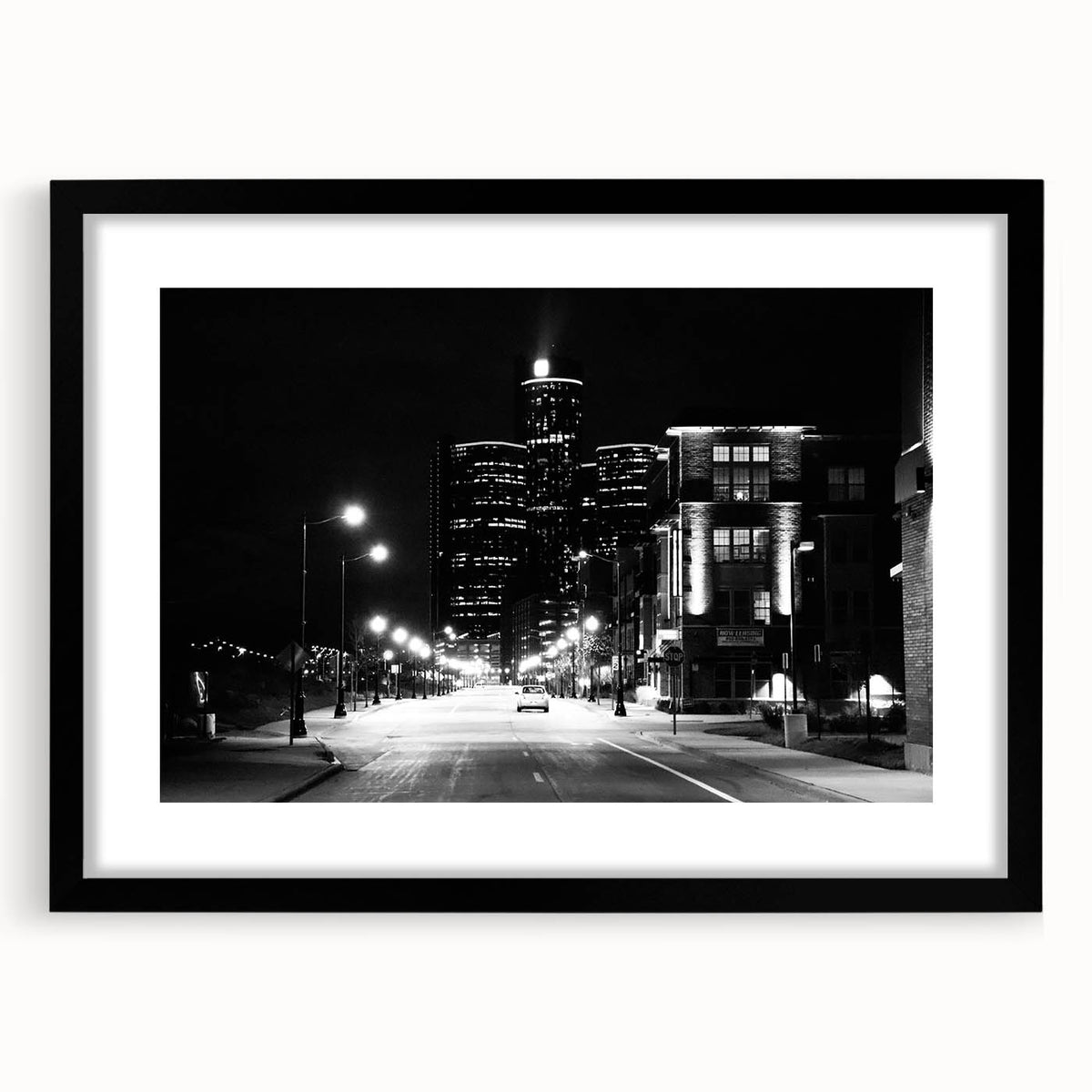 Extra large abstract art print of colorful, textured Detroit skyline on framed black mat, ideal for living room decor.