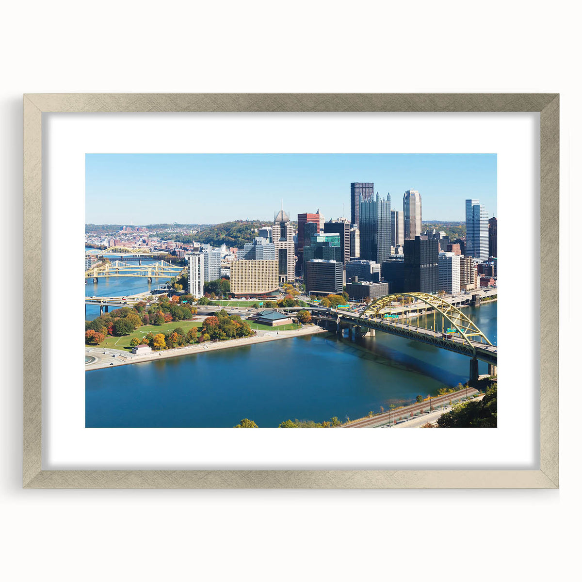 Textured abstract art print depicting a stylized Pittsburgh skyline in muted gray tones on a framed silver mat.