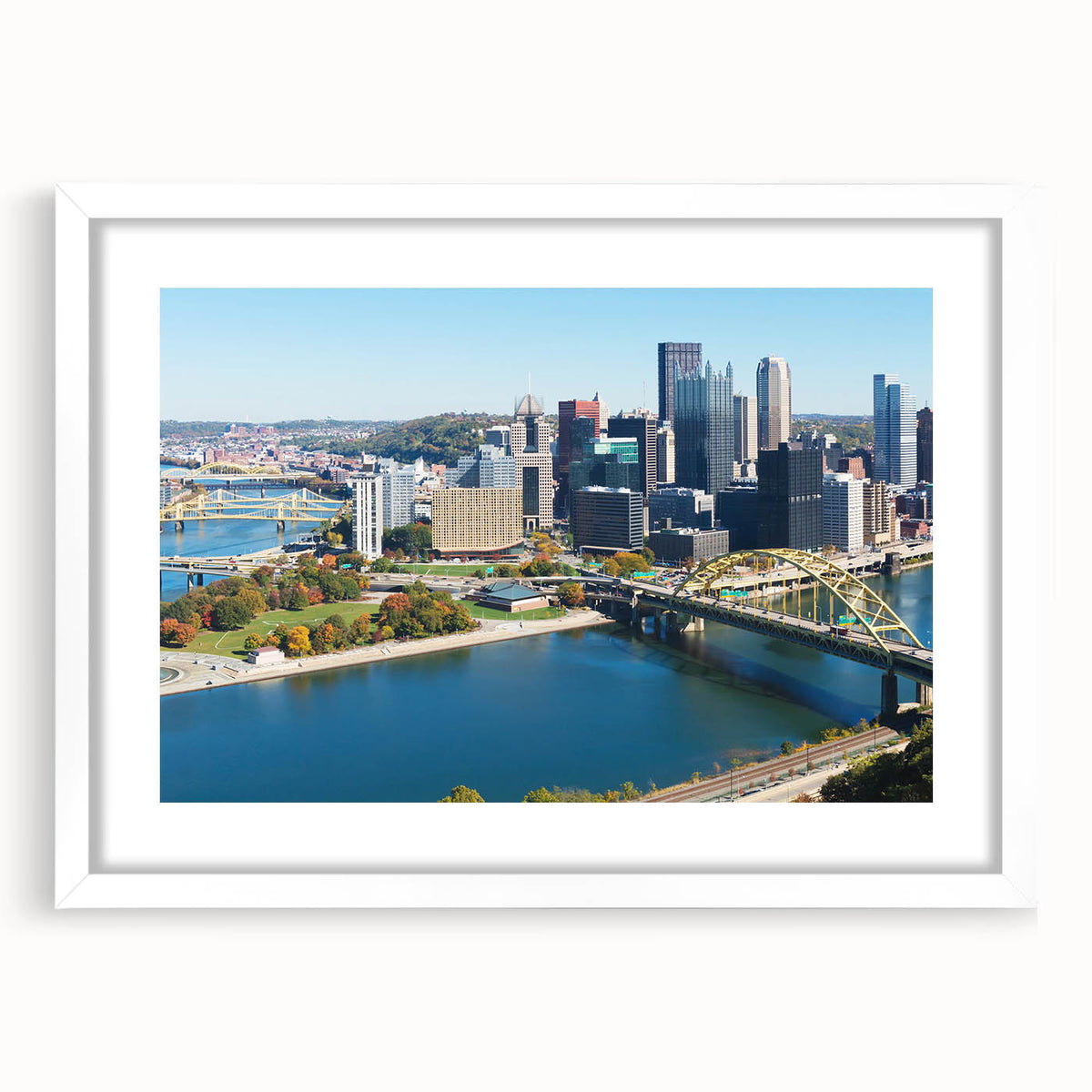 Abstract art print of Pittsburgh skyline in muted gray and blue tones on a framed white mat, suitable for dining room decor.