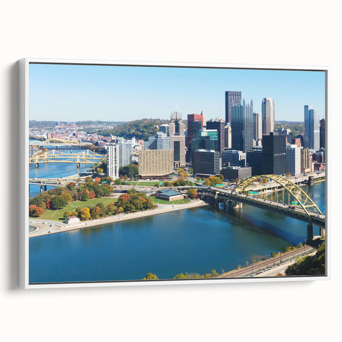 Vintage poster art of Pittsburgh skyline in colorful hues on a white framed canvas, ideal for living room decor.