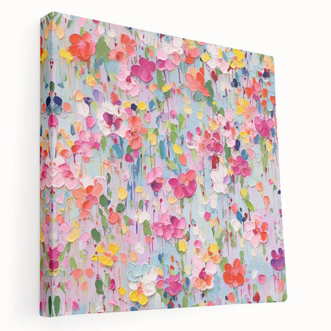 Stretched canvas wall art displaying vibrant abstract floral designs in shades of blue, pink, and gold, showcasing a modern and artistic home decor style.