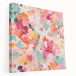 Stretched canvas wall art showcasing vibrant abstract floral designs in shades of blue, pink, and green, perfect for modern home decor.
